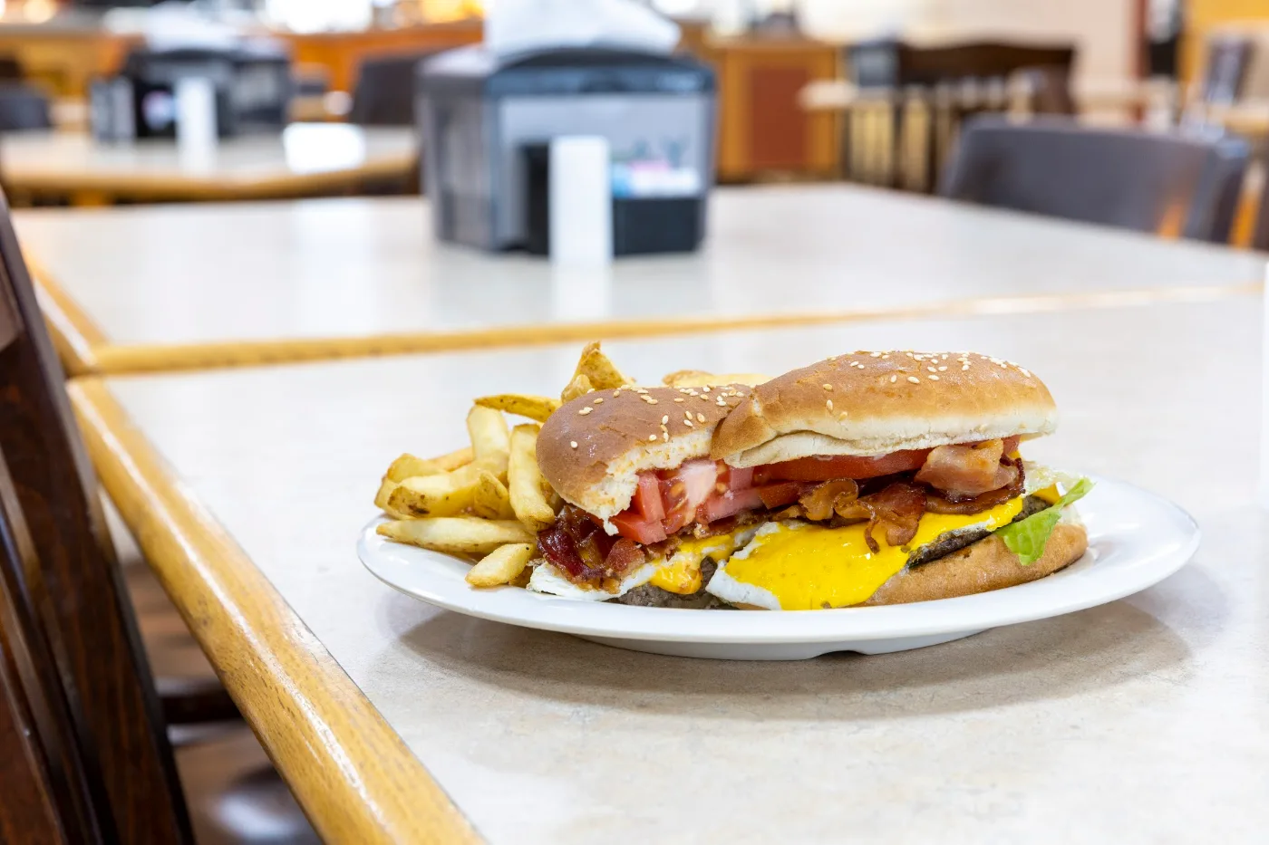 Bacon cheeseburger with a fried egg and hand-cut fries